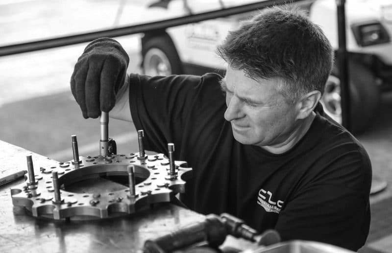 A mechanic carefully doing their job